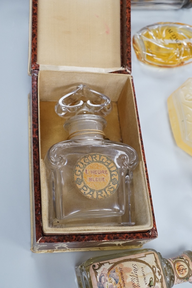 A Baccarat Guerlain perfume bottle in original box and a collection of other empty perfume bottles